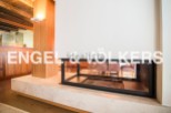 This stunning property boasts a modern, built-in fireplace, perfect for cozy nights in.