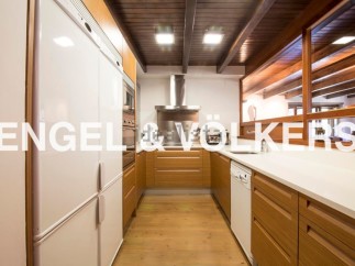 Stunning kitchen with modern appliances and wooden cabinetry.