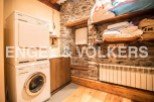 Rustic charm meets modern convenience in this unique laundry room.