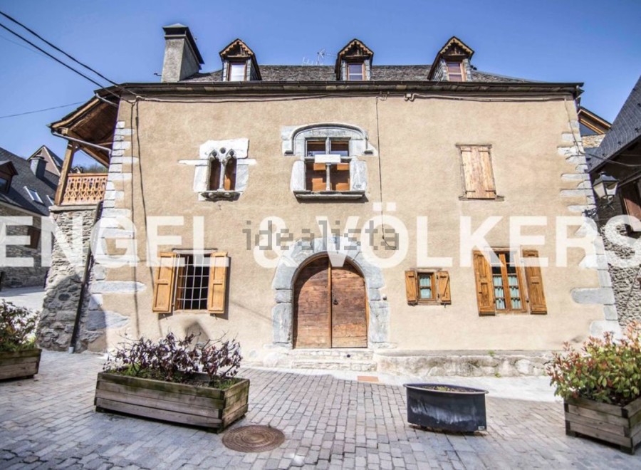 This charming stone house is located in a picturesque village setting.