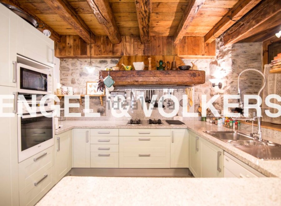 Rustic charm meets modern convenience in this stunning kitchen.