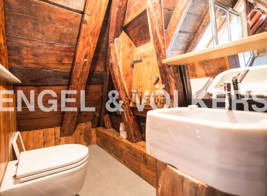 Rustic charm meets modern convenience in this unique bathroom.