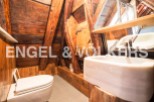 Rustic charm meets modern convenience in this unique bathroom.