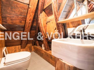 Rustic charm meets modern convenience in this unique bathroom.