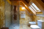 Luxury bathroom with a walk-in shower, bidet, and toilet.