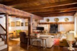 Rustic charm meets modern comfort in this stunning home boasting exposed wooden beams, a cozy fireplace, and ample living space.
