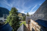 Nestled in the mountains, this charming property boasts stunning views and traditional architecture.