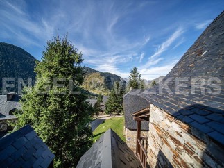 Nestled in the mountains, this charming property boasts stunning views and traditional architecture.