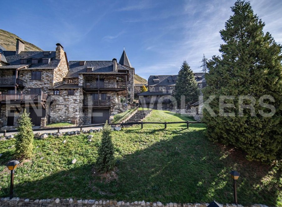 This stunning stone property boasts breathtaking mountain views and a prime location.