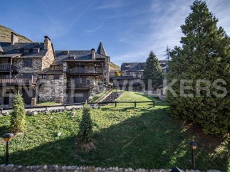 This stunning stone property boasts breathtaking mountain views and a prime location.