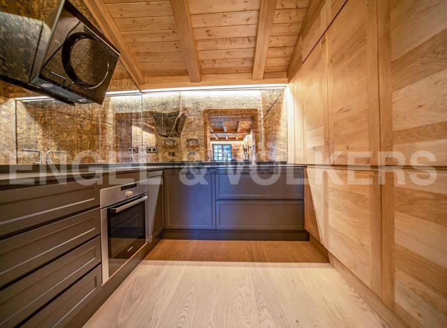 This stunning kitchen boasts a unique blend of modern and rustic design.