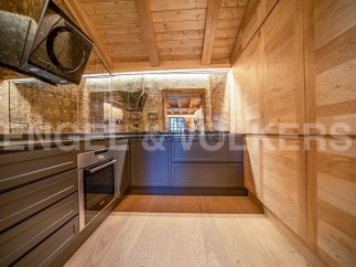 This stunning kitchen boasts a unique blend of modern and rustic design.