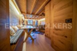 This stunning chalet boasts a unique blend of rustic charm and modern elegance.