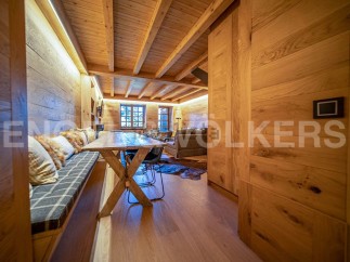 This stunning chalet boasts a unique blend of rustic charm and modern elegance.
