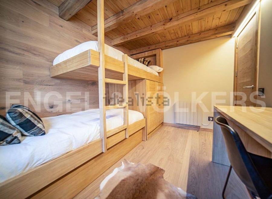 This stunning chalet boasts a charming bunk bed room, perfect for families or groups.