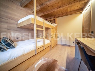 This stunning chalet boasts a charming bunk bed room, perfect for families or groups.