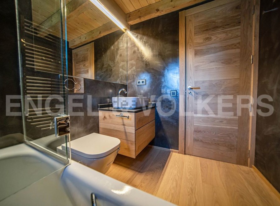 This stunning bathroom boasts a sleek, modern design with high-end finishes.