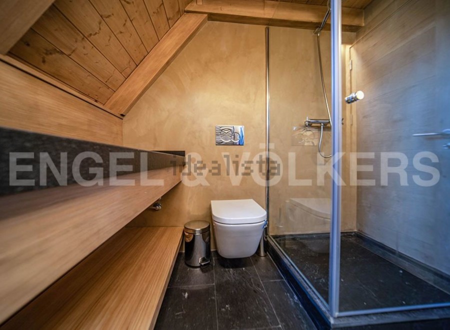 This stunning bathroom boasts a luxurious sauna, perfect for relaxation and rejuvenation.