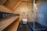 This stunning bathroom boasts a luxurious sauna, perfect for relaxation and rejuvenation.