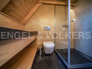 This stunning bathroom boasts a luxurious sauna, perfect for relaxation and rejuvenation.