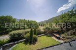 Mountain views and a private garden highlight this stunning property.