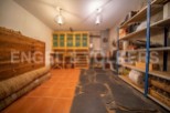 This unique property boasts a spacious, well-equipped basement perfect for storage and organization.