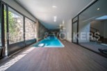 Indulge in luxury with this stunning indoor pool, seamlessly integrated into a modern architectural design.