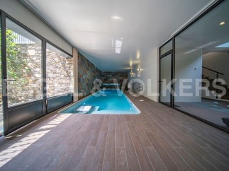 Indulge in luxury with this stunning indoor pool, seamlessly integrated into a modern architectural design.