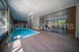 This stunning property boasts a luxurious indoor swimming pool, perfect for year-round relaxation.