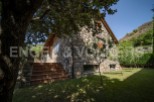 This stunning stone house boasts a picturesque setting, nestled amongst lush greenery and offering breathtaking views.