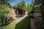 This charming property boasts a rustic stone outdoor kitchen and barbecue area, perfect for al fresco dining and entertaining.