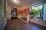 This stunning property boasts a bright and spacious laundry room, complete with modern cabinetry and ample storage.