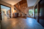 This stunning property boasts a grand entrance hall with a beautiful wooden staircase, creating a welcoming and spacious atmosphere.