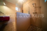 This stunning bathroom boasts a modern, sleek design with a spacious walk-in shower.