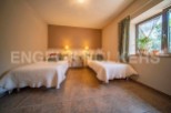 Cozy rustic bedroom with twin beds, perfect for a relaxing getaway.