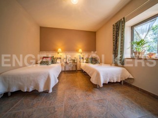 Cozy rustic bedroom with twin beds, perfect for a relaxing getaway.