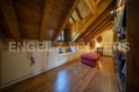 Discover this stunning attic conversion boasting a spacious walk-in closet and built-in storage solutions.