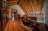 This stunning property boasts a spacious hallway with hardwood floors and built-in wooden cabinetry.