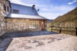 Mountain retreat with stone exterior and patio.