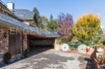 This stunning property boasts a spacious garage, perfect for housing multiple vehicles.