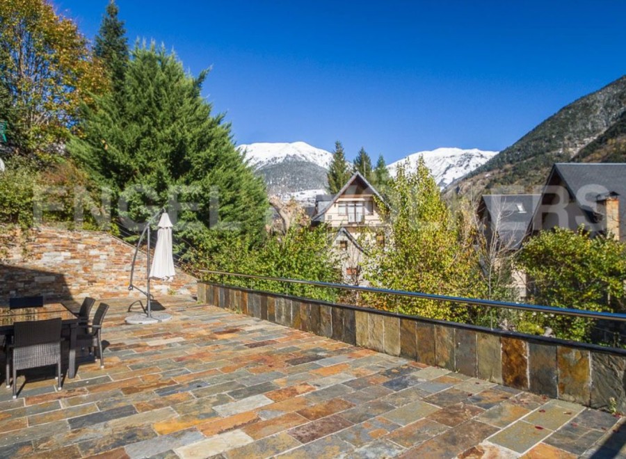 This stunning property boasts a spacious patio with mountain views, perfect for outdoor entertaining.