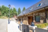 This stunning stone house boasts a spacious layout, perfect for comfortable living.
