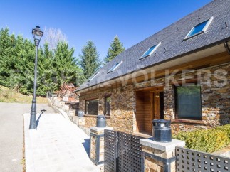 This stunning stone house boasts a spacious layout, perfect for comfortable living.
