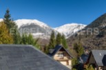 Mountain view home with slate roof.