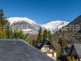 Mountain view home with slate roof.
