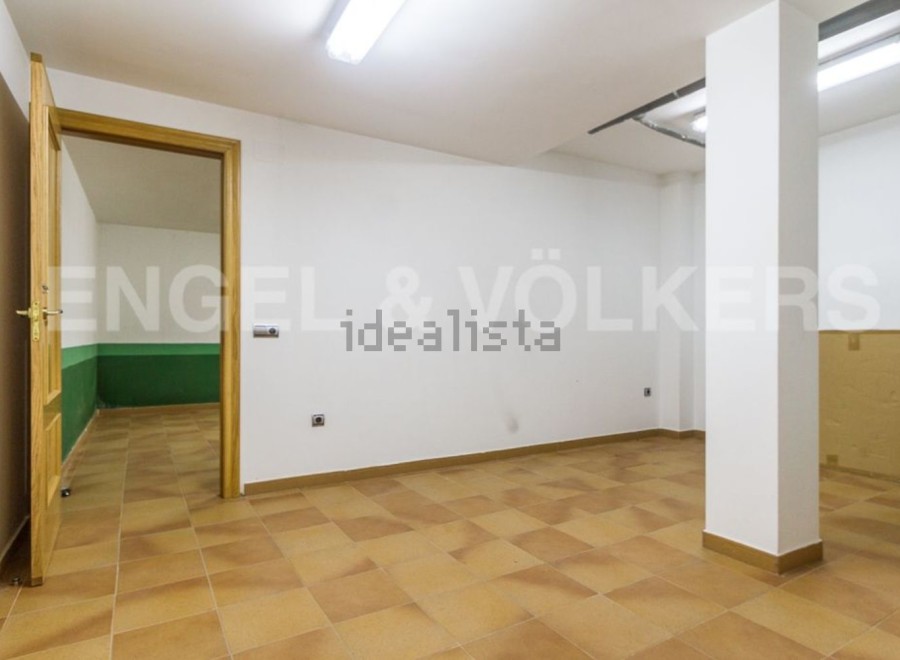 Spacious basement with tiled flooring and ample natural light.