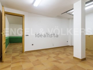 Spacious basement with tiled flooring and ample natural light.