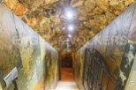 Descend into this unique wine cellar, showcasing a stunning stone and slate design.