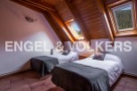 Cosy attic bedroom with twin beds and mountain views.