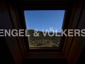 Wake up to breathtaking mountain views from this unique attic room.